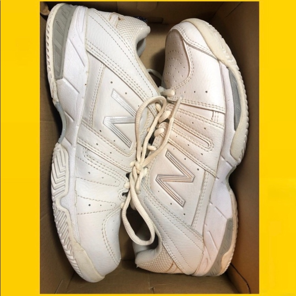 Women’s New Balance 549 white tennis court shoes.